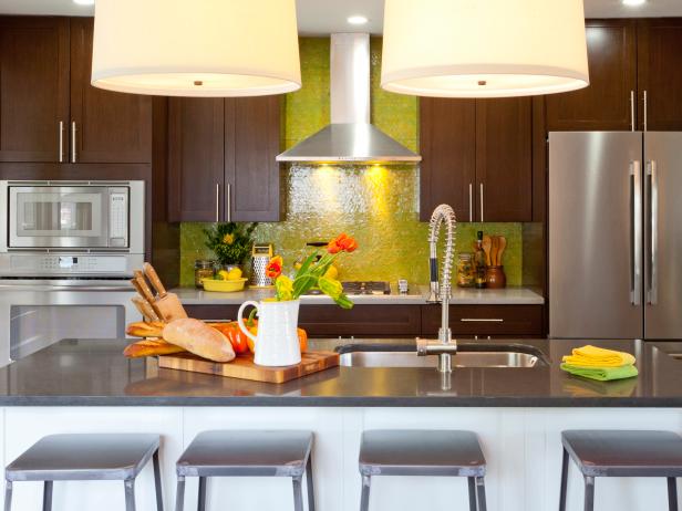 Transitional Kitchen With a Stainless Steel Island and Green Backsplash Transitional Kitchen With a Stainless Steel Island and Green Backsplash