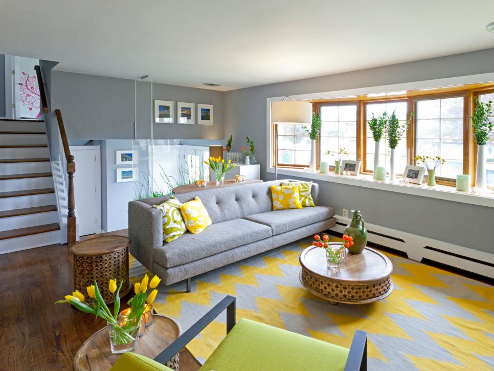 Gray Living Room With Gray Sofa, Chevron Rug and Yellow Accents