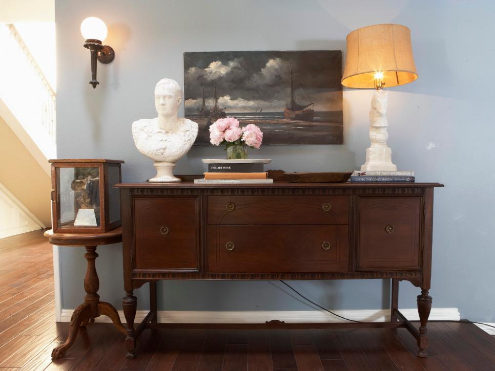 Brown Wood Credenza With Traditional Decor Against Light Blue Wall