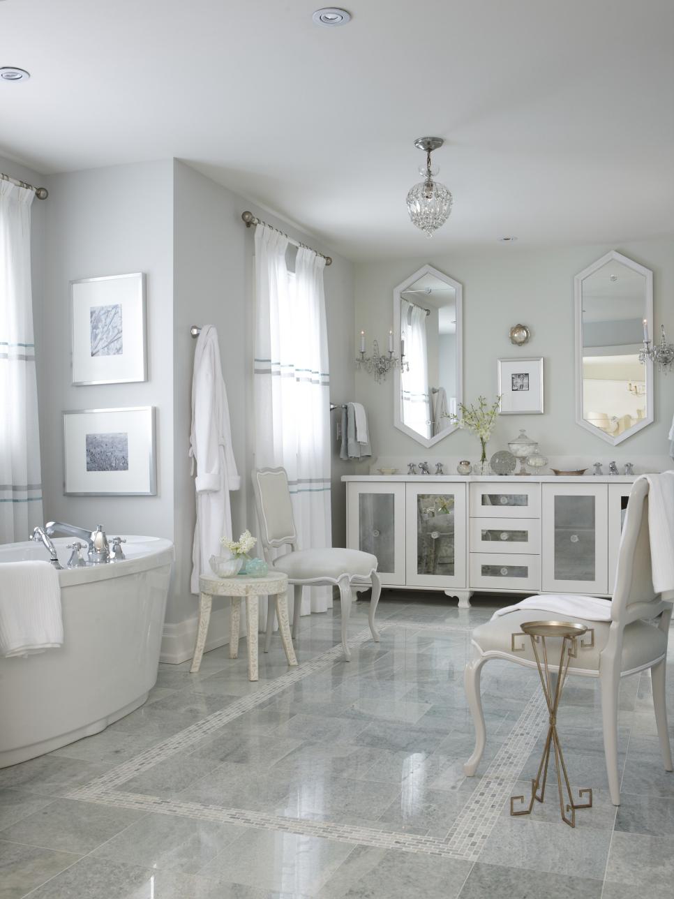 White Spa Bathroom With White Vanity, Freestanding Tub and Marble Tile