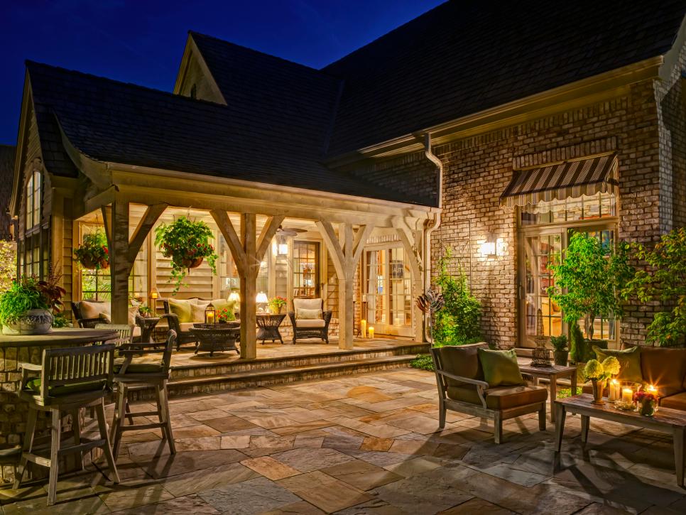 Traditional Outdoor Room and Stone Patio with Multiple Seating