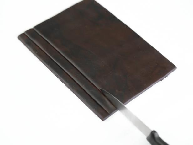 Reuse the roof templates to cut two matching pieces. Make lines in the pieces using the back of a knife, at about 1/2-inch intervals.