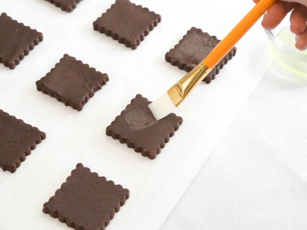 Lightly brush squares with egg white.