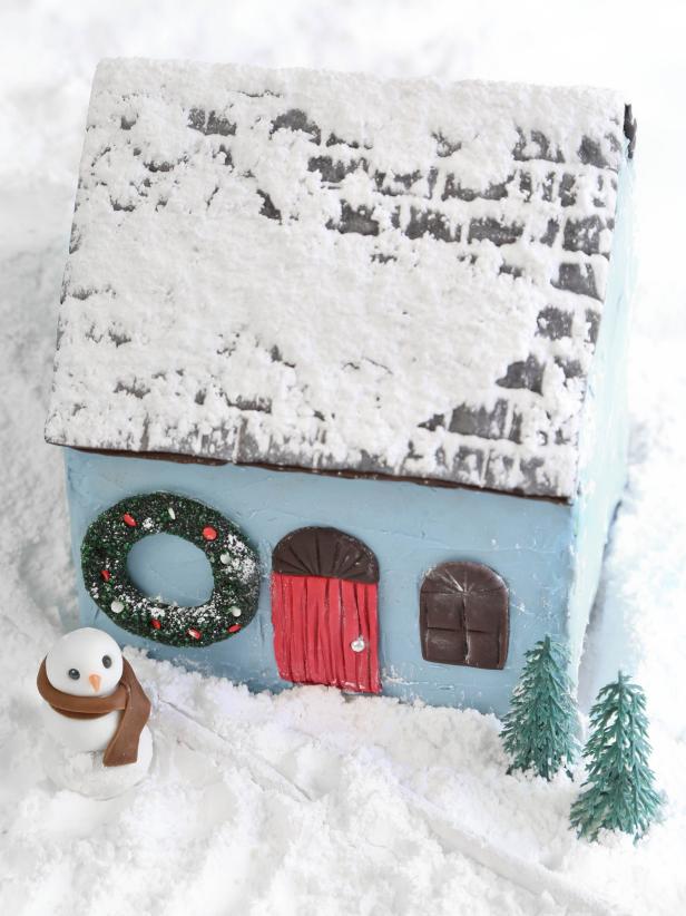 Blue Gingerbread House With Royal Icing and Chocolate Fondant