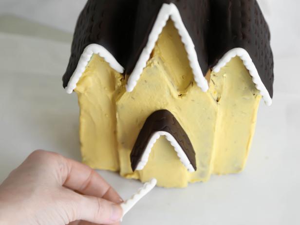 In step 22 of this project, attach the pieces using royal icing as glue.