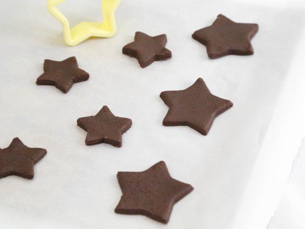 Cut out desired shapes from dough and transfer to prepared baking sheet.