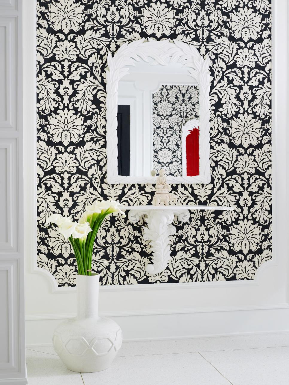 Entryway With Bold, Black and White Damask Wallpaper and White Mirror