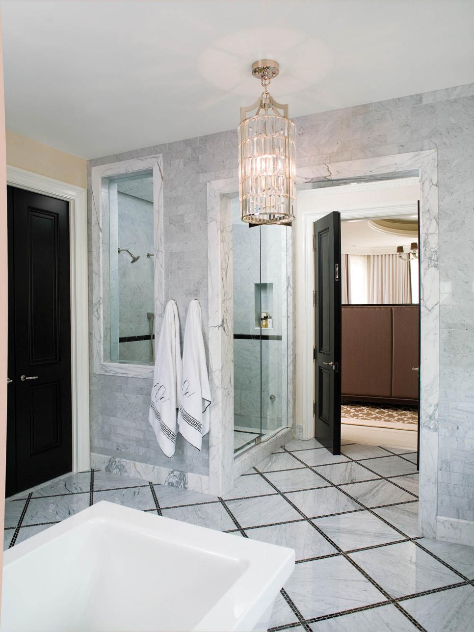 Large Bathroom With Marble Tile and Black Granite
