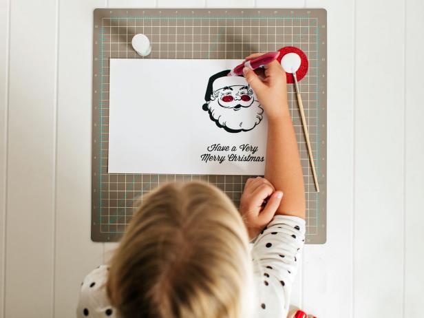Use glitter glue, cotton balls, markers or any other fun embellishments to make your Santa card truly one-of-a-kind. Tip: For the "Dear Santa" card design, have the kids write to Santa or create a wish list inside the card.