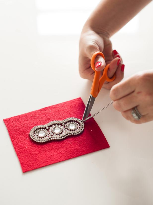 When you've completed the sparkling design for your headband, remove the excess rhinestone trim.