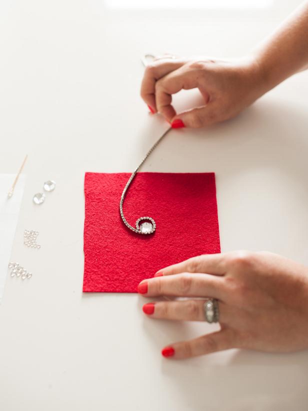 Wrap the small rhinestone trim around the large crystal to determine how much you need then cut off the excess.