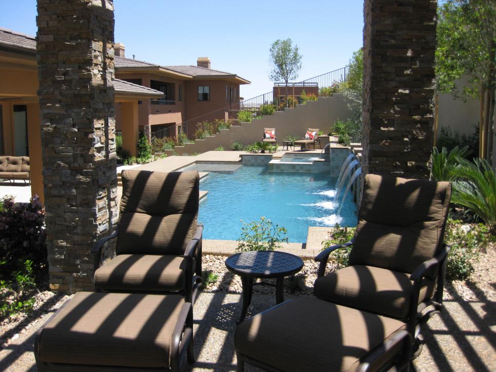 Poolside Patio with Flagstone Columns and Lounge Chairs