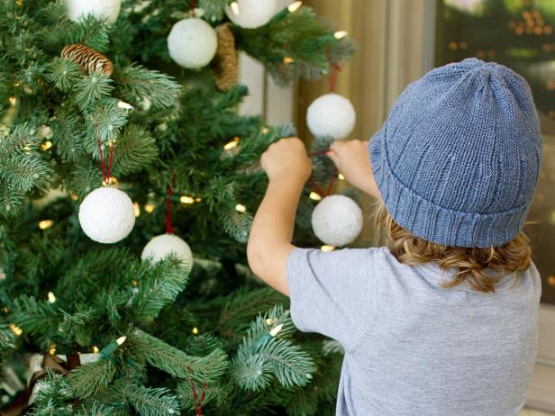 Loop twine through the pin and hang your finished ornaments on the tree.