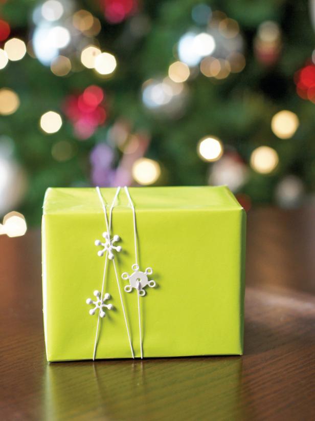 When your string is finished, wrap around gifts placing the findings and ornaments where you like. Cut the string where necessary and tie a double knot on the bottom of the gift.