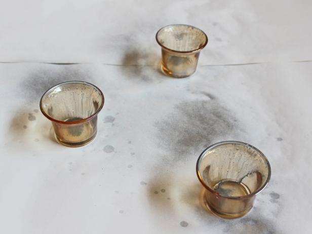 The water droplets won't allow the paint to adhere to the glass creating the mottled, mercury glass finish. Tip: Don't worry if some of the spray paint and water run down the sides and pool in the bottom, that's normal.