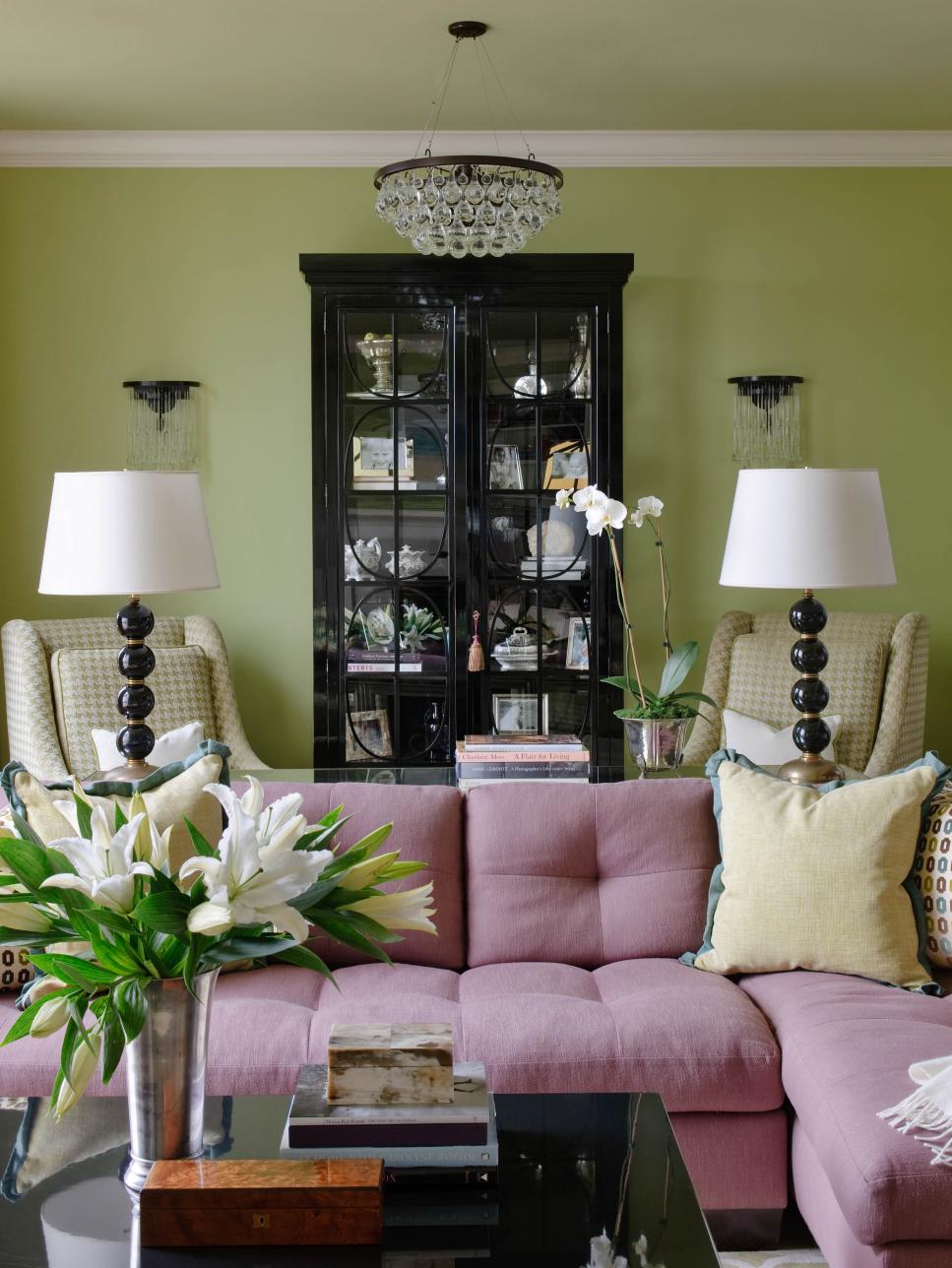 Green Transitional Living Room With Pink Couch and Yellow Chairs