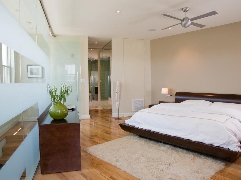 Neutral Bedroom With Etched-Glass Wall and Platform Bed