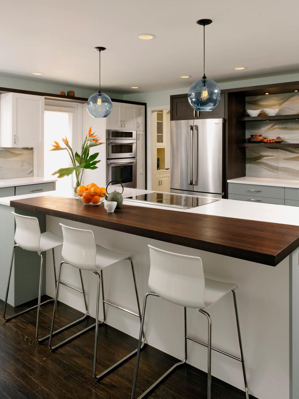 Contemporary Kitchen With Orb Lights and Unique Backsplash 