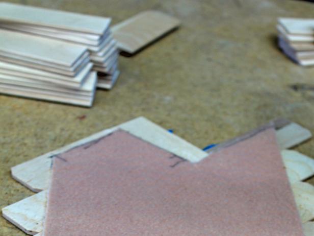 Spray back of felt with spray adhesive. Let stand for 30 seconds to allow glue to become tacky, then attach to back of table runner. Let dry for a few minutes, then flip over and remove painter's tape.