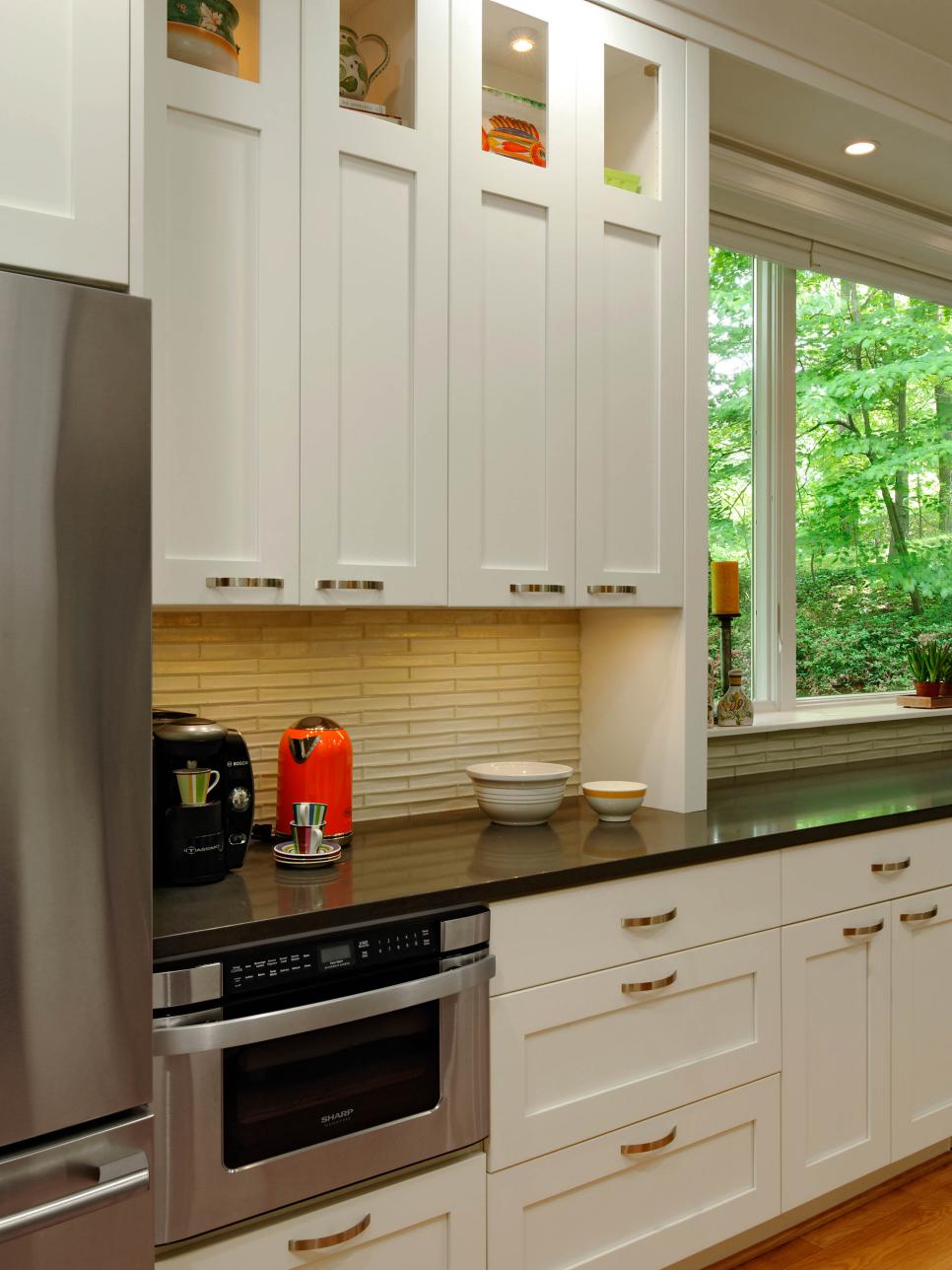 Contemporary Kitchen With White Cabinets and Black Quartz Countertop