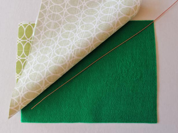 Sandwich a cut piece of wire between a sheet of felt and the fusible side of the fabric.