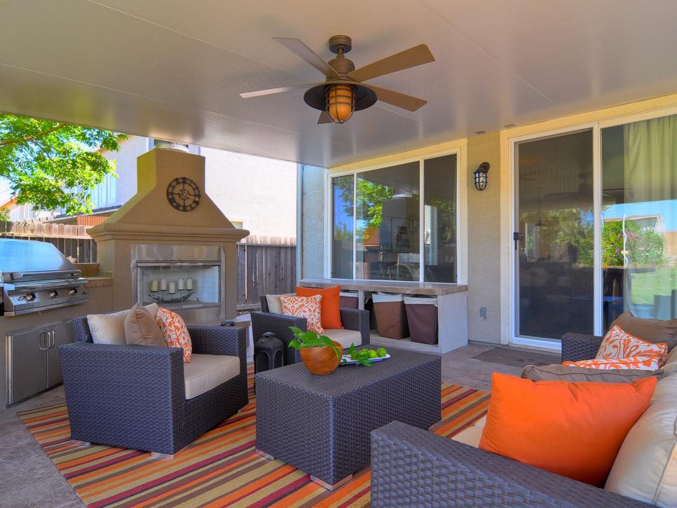 Contemporary Outdoor Living Room and Kitchen With Pops of Orange