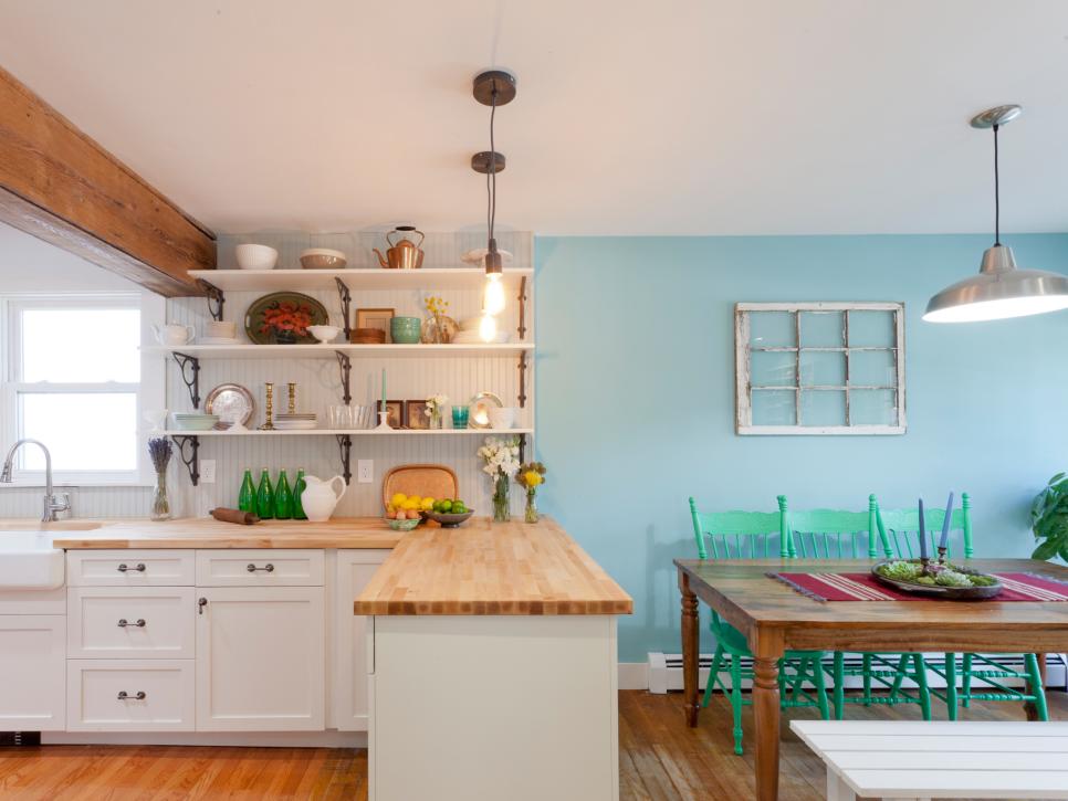 White Cottage Kitchen With Adjacent Blue Dining Area