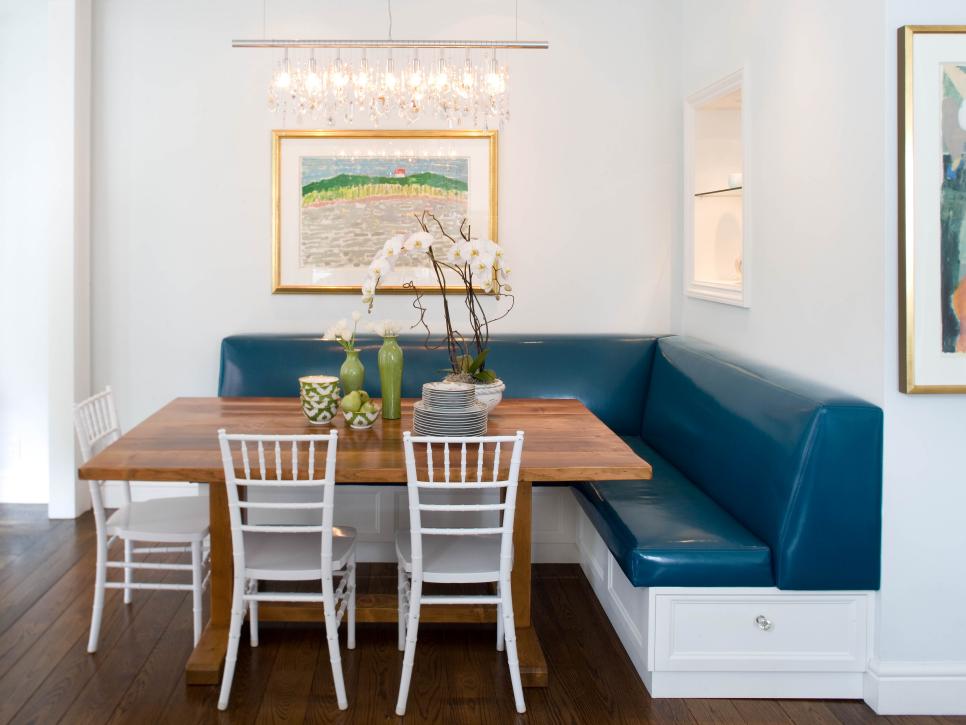 White Dining Area With Custom Wood Table and Blue Vinyl Banquette