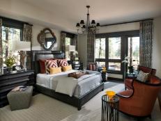 With a palette inspired by fall colors, the master bedroom combines rustic, masculine details with bold colors and graphic patterns.