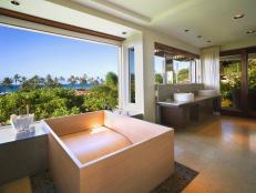 Unique custom wooden bathtub in master bathroom.