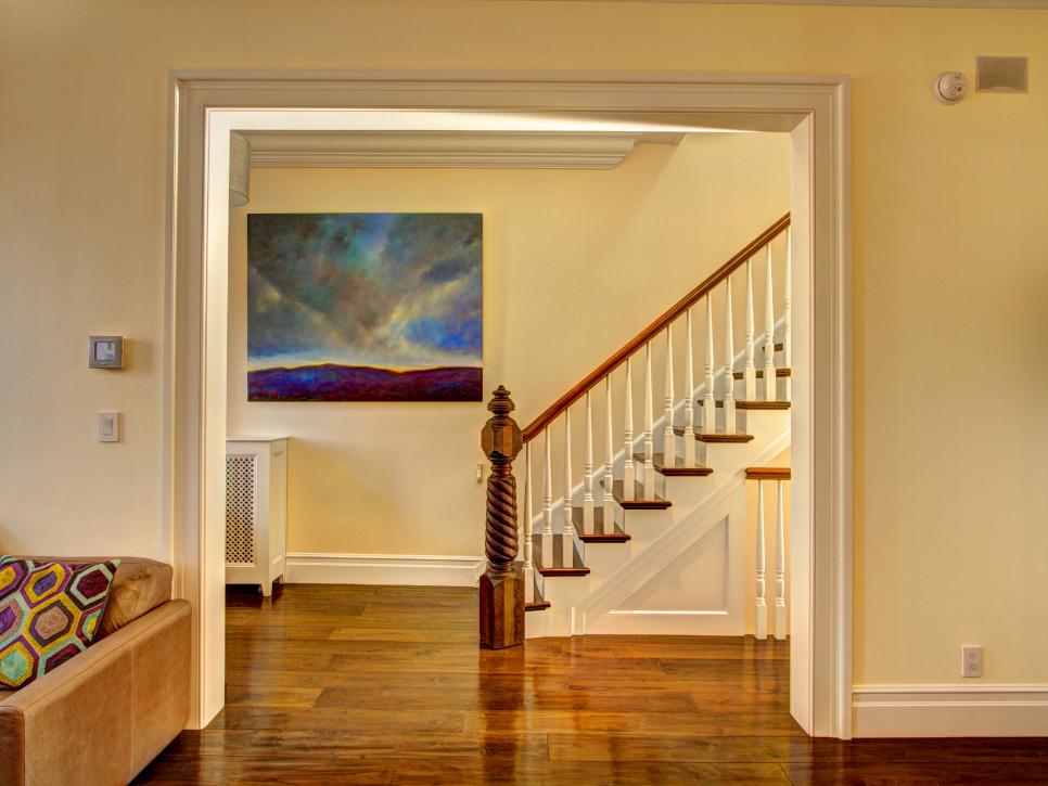 Beige Entryway With Carved Newel Post Staircase