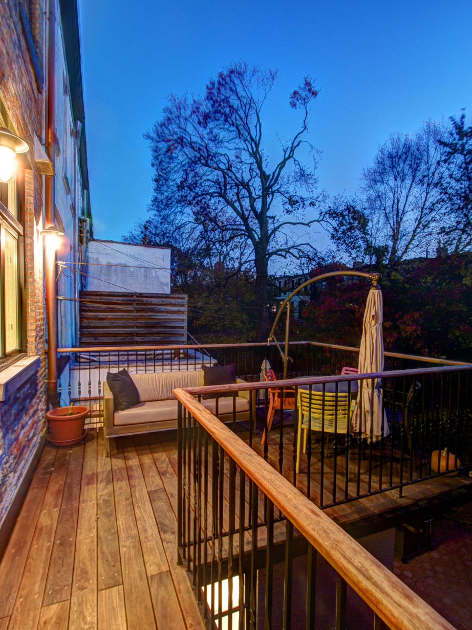 Ipe deck on urban brownstone surrounded by metal railing