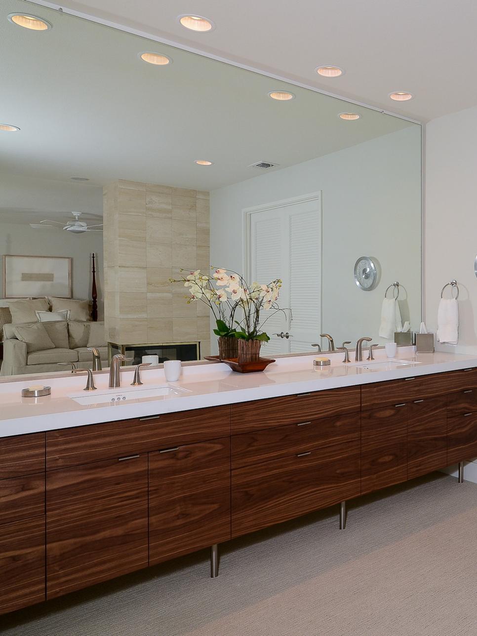 Wall-Length Double Vanity With Wood Cabinets and White Countertop