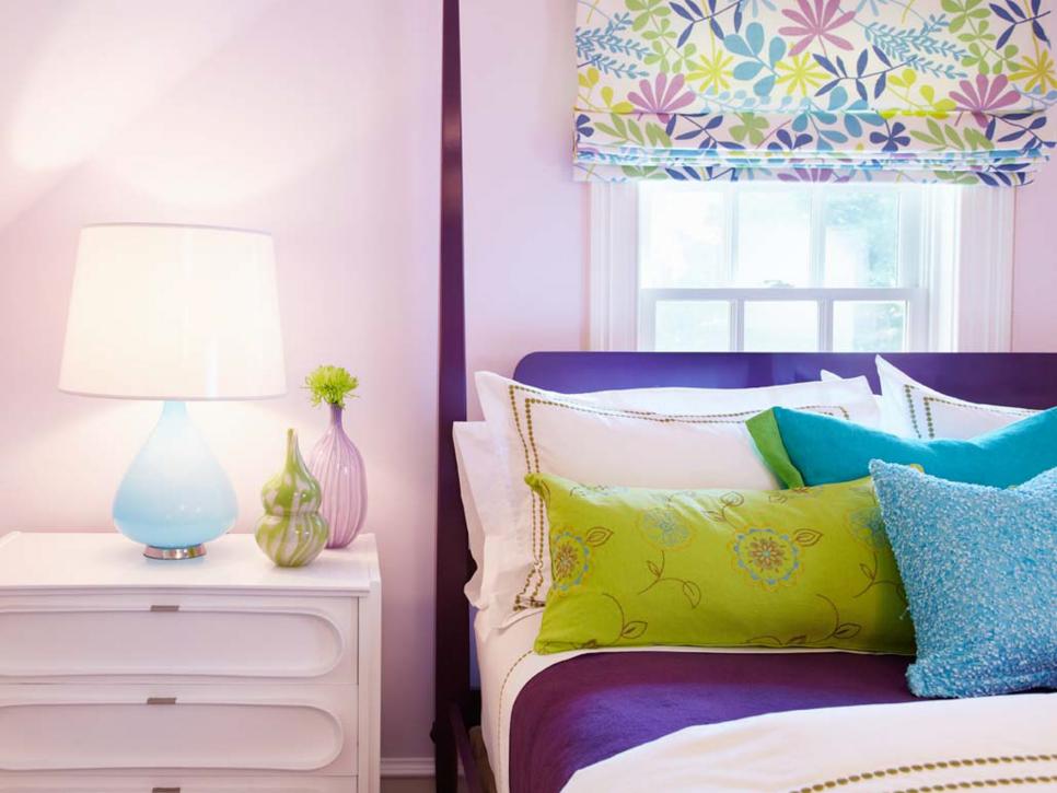 Kid's Bedroom with Pink Walls, White Nightstand and Purple Bed