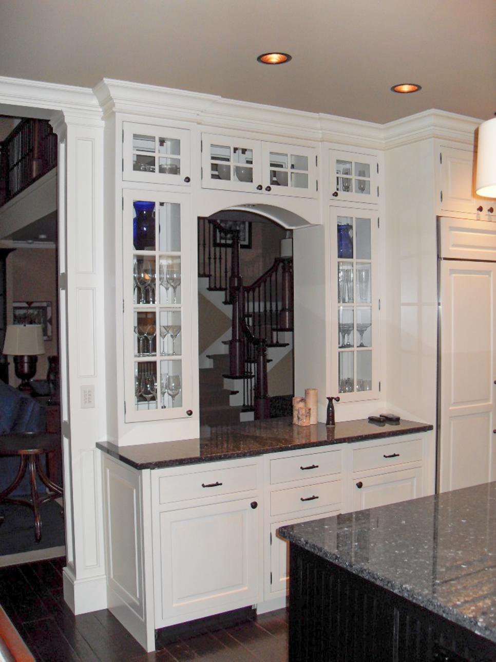 Transitional Kitchen Pass-Through Surrounded by Glass-Front Cabinets