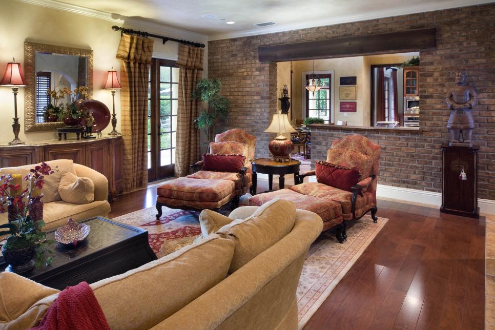 Mediterranean Family Room With Chaise Longue Chairs and Brick Wall