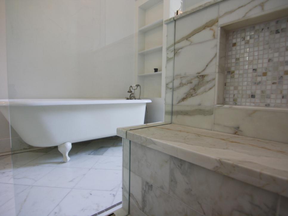 Bathroom With Clawfoot Bathtub and Marble Mosaic Tile Shower Seat