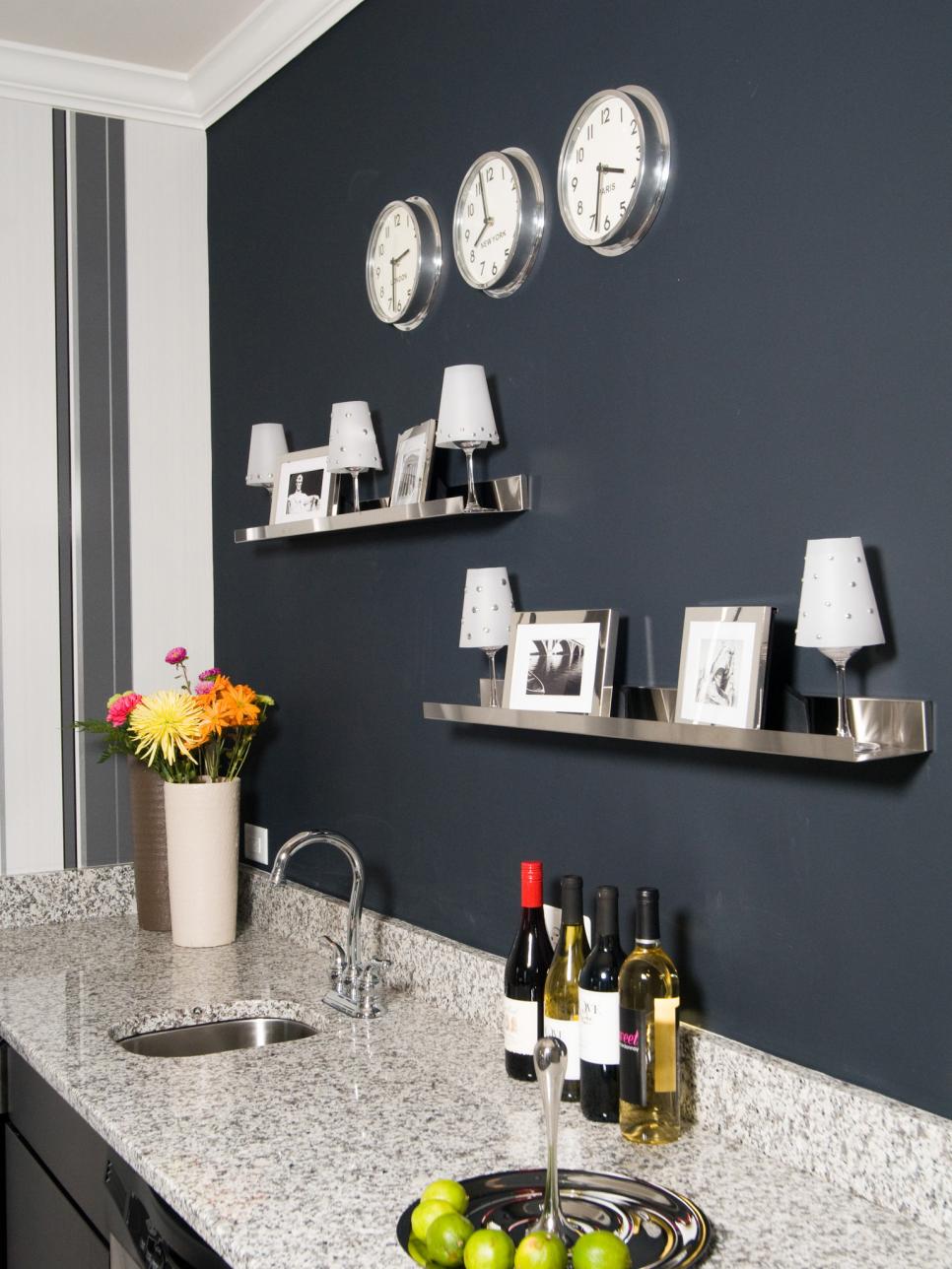 Dark Gray Wall With Stainless Steel Shelves and Wet Bar