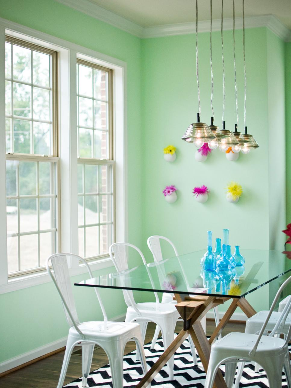 Kitchen Dining Space With Mint-Green Walls and Glass-Top Table