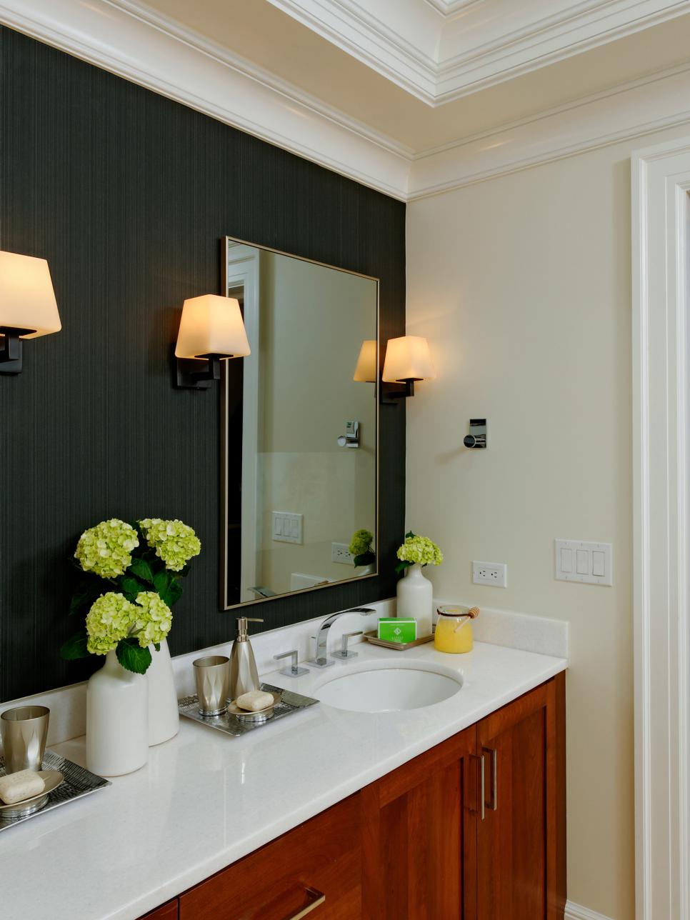 Bathroom With Black Wallpaper Focal Wall, Wood Vanity and Sconces
