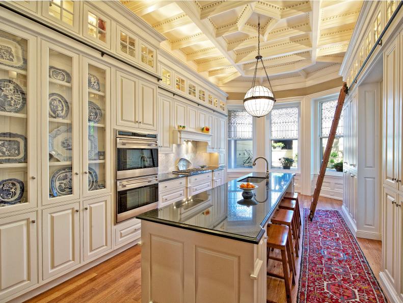 Traditional Kitchen With White Cabinetry and Island Seating