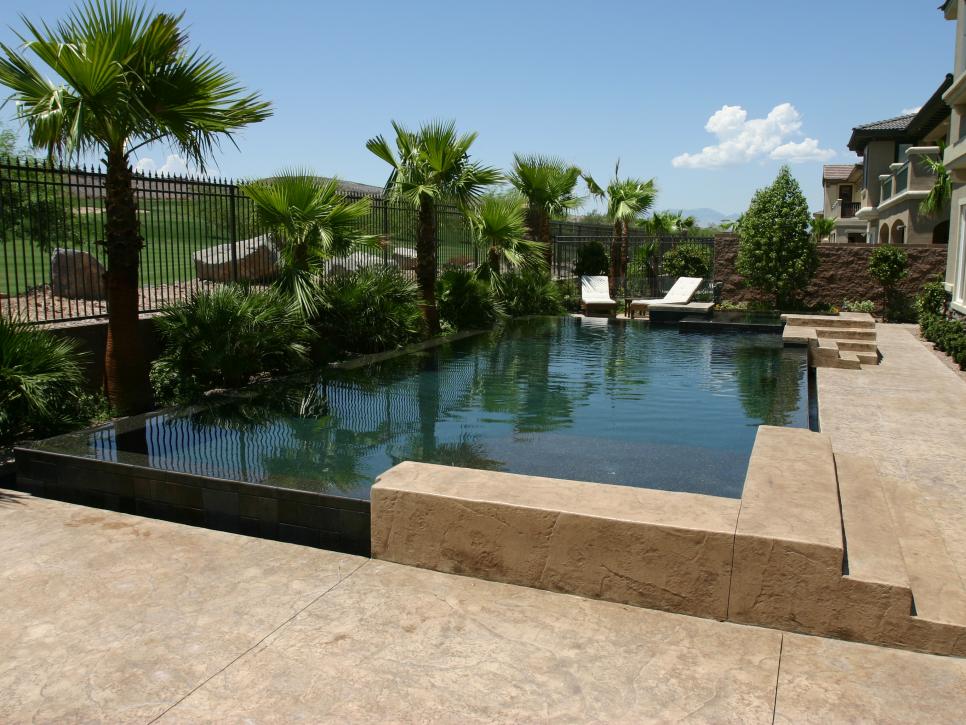 Contemporary Pool With Corner Entry and Fence