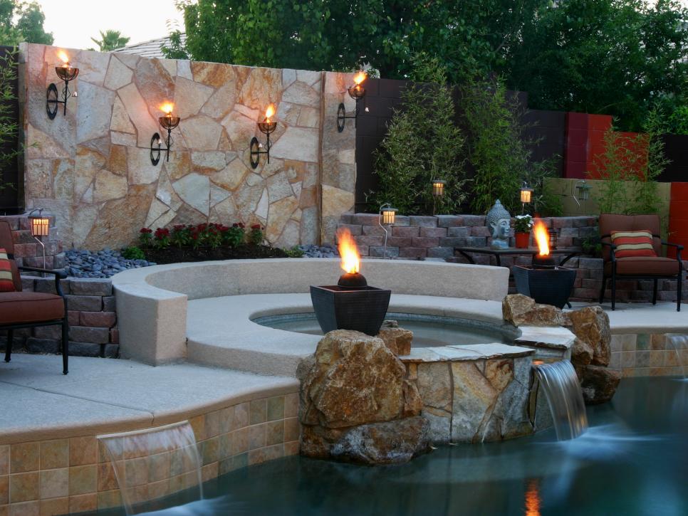 Spa and Pool with Stone Wall, Waterfall and Fire Elements