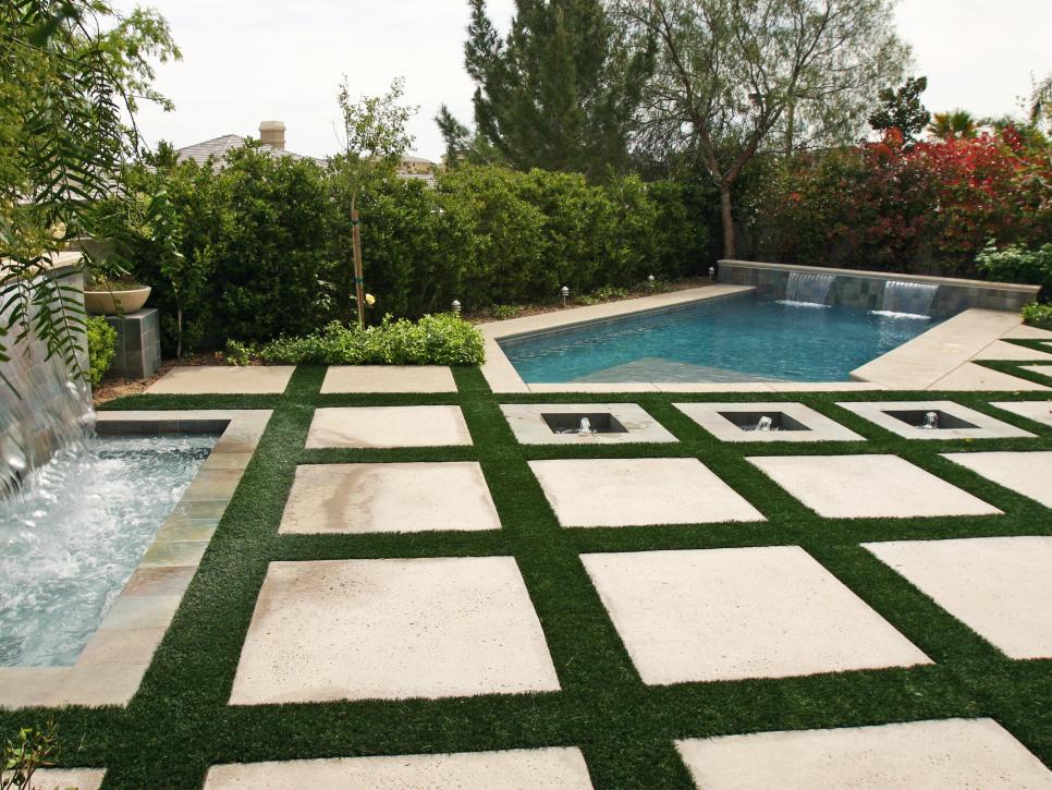 Poolside Patio With Large Square Pavers and Grass