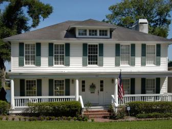 White Colonial Foursquare Home With American Flag