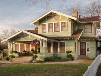 Green Home With Red Windows 