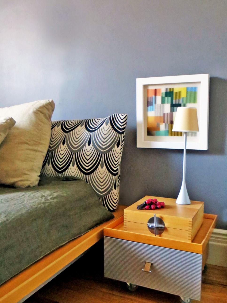 Bedroom with Contemporary Nightstand & Colorful Artwork 