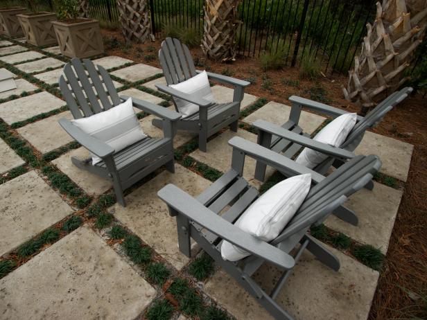 Cement Stepping Stone Patio With Gray Adirondack Chairs Cement Stepping Stone Patio With Gray Adirondack Chairs