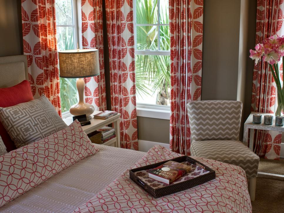 Brown and White Contemporary Bedroom With Mix of Red Patterned Fabrics