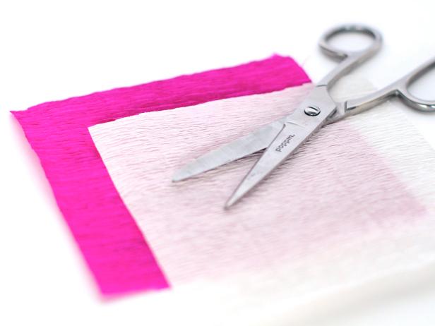 Cut several 5-by-5-inch squares out of both pink and white crepe paper.